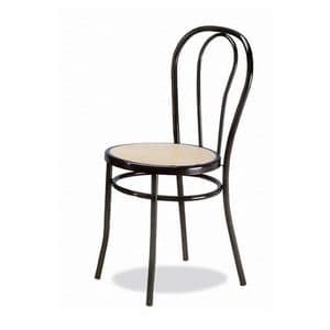 002, Stuhl aus gebogenem Metall, sitzt in Wien Stroh